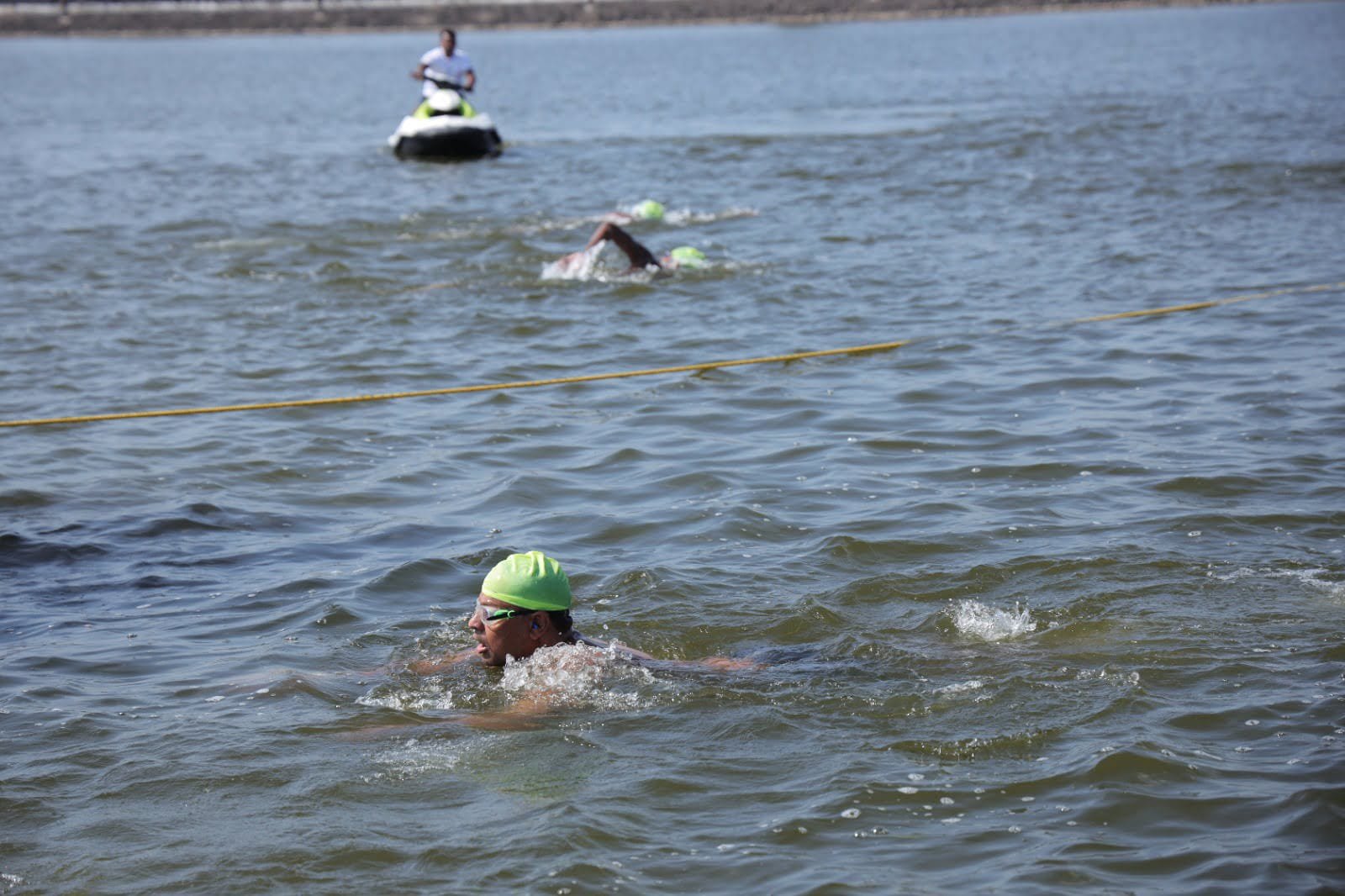 Endurance swimmer crossing dark open water