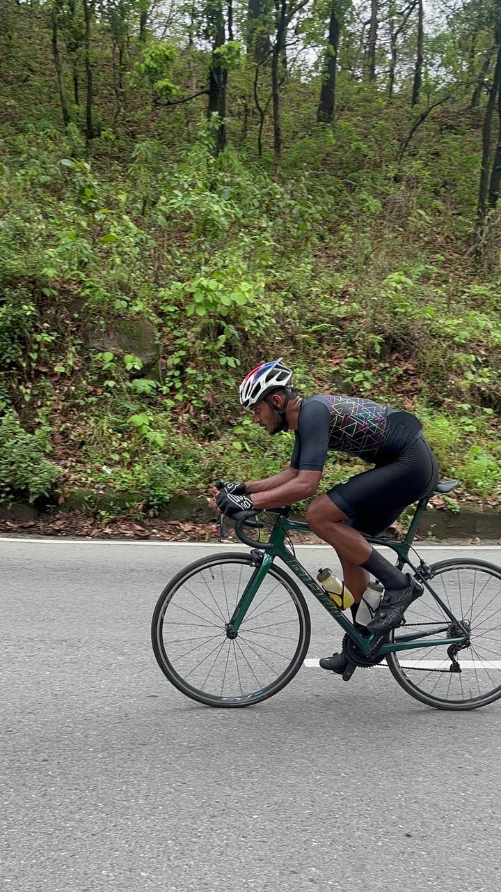 Cyclist navigating a high-speed mountain switchback